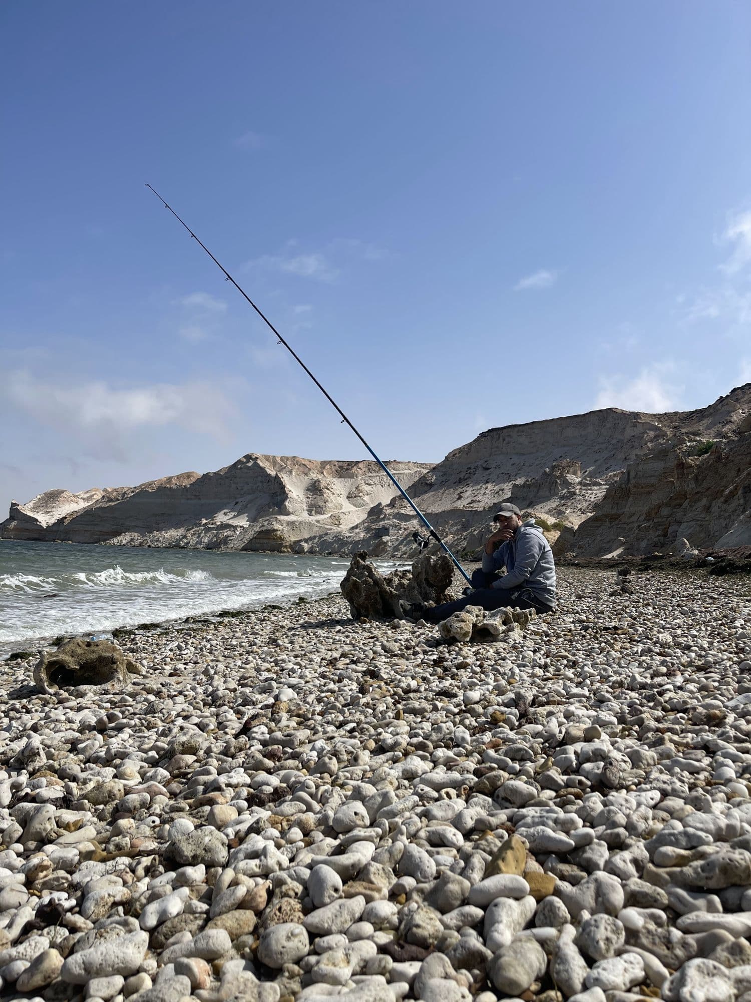 Sea fishing tackle and a rod prepared for a beginner trip on the Cornish coast